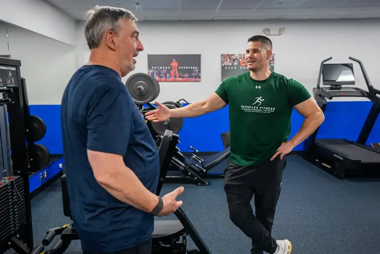 Trainer greeting a client at the start of a session