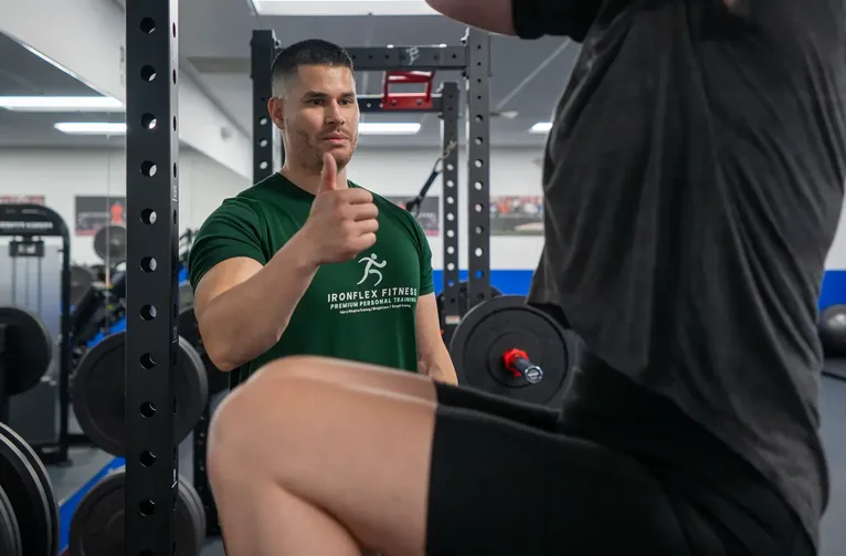 Trainer cueing a client mid-set